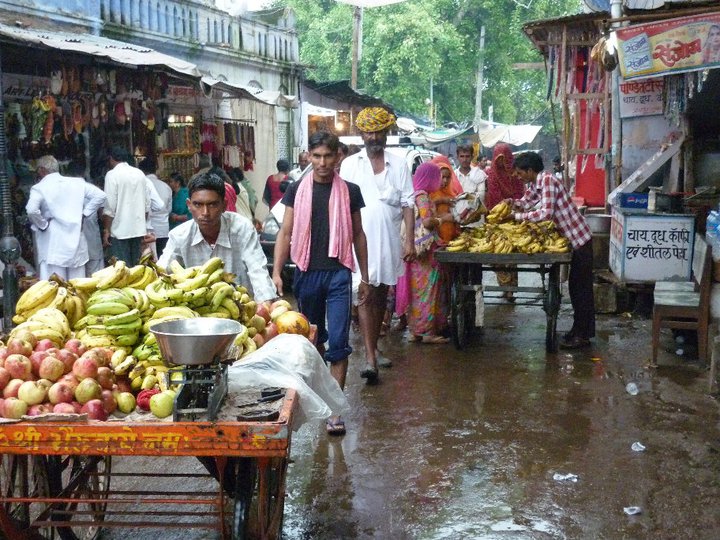 street life in India - life goes on - despite the rain
