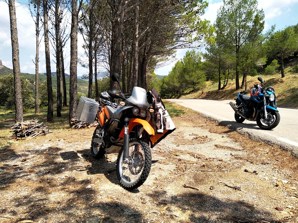 motorbikes parked under the trees on a tour in Spain