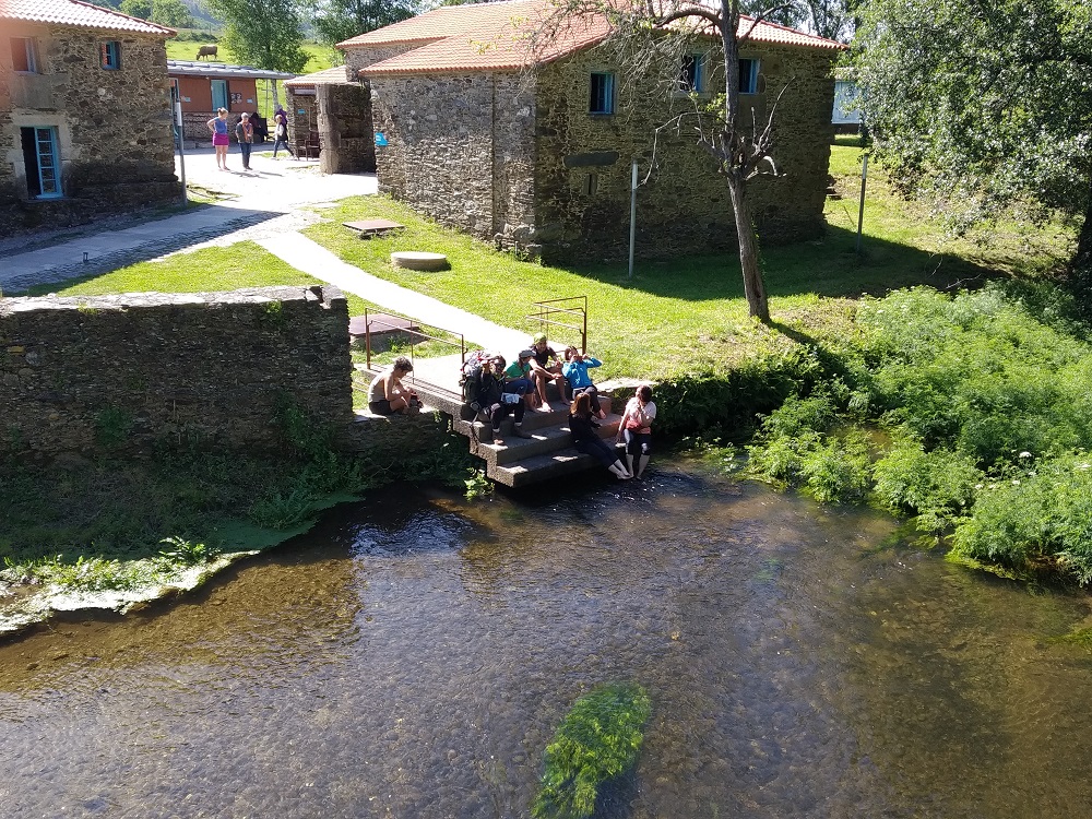 friends relaxing on the riverbank